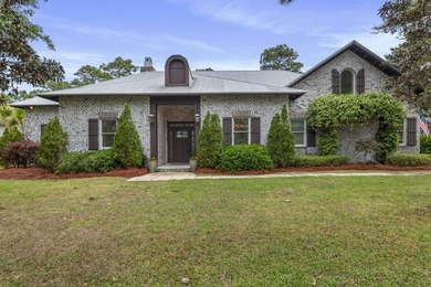 Tucked within the exclusive, gated waterfront community of - photo 1