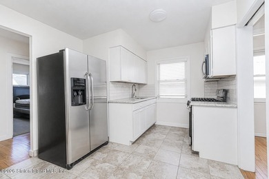 South Beach - welcome to this 6/6 2-family, fully brick, and - photo 9