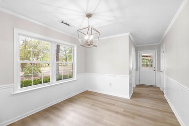 TOTALLY RENOVATED, ALL NEW KITCHEN, FRESH PAINT, NEW FLOORING - photo 8