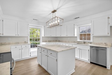 TOTALLY RENOVATED, ALL NEW KITCHEN, FRESH PAINT, NEW FLOORING - photo 10