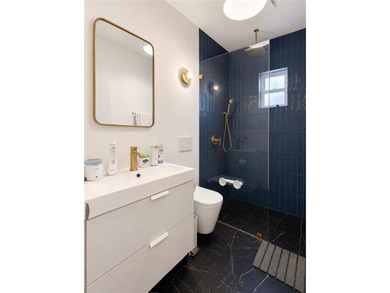 Welcome to this warm and inviting detached single-family home - - photo 7