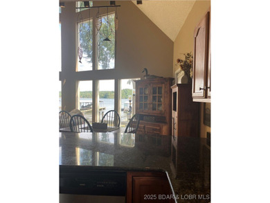 > A wall of windows and vaulted ceilings. Main level living! Big - photo 11