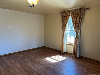 A charming three-bedroom, two-bath home offering a warm and - photo 3