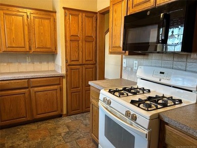 A charming three-bedroom, two-bath home offering a warm and - photo 5