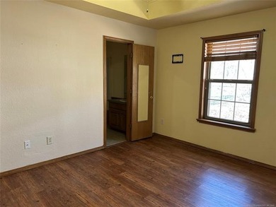A charming three-bedroom, two-bath home offering a warm and - photo 8