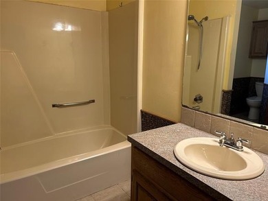 A charming three-bedroom, two-bath home offering a warm and - photo 10
