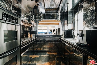 Bold design and modern features coalesce in this newly remodeled - photo 9