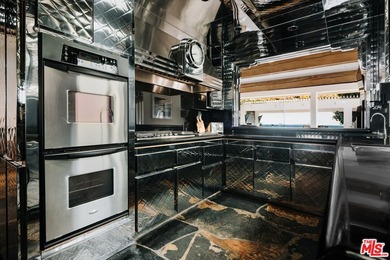 Bold design and modern features coalesce in this newly remodeled - photo 10