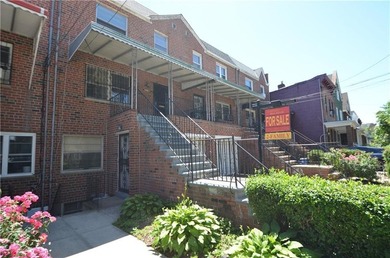 Solid brick 2-family home with private driveway and built-in - photo 2