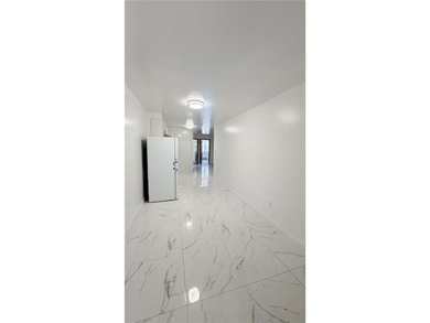 Two dwelling brick house in prime of Bath Beach featuring a - photo 5
