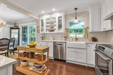 Welcome to this mint-condition Cape Cod nestled on a quiet - photo 7