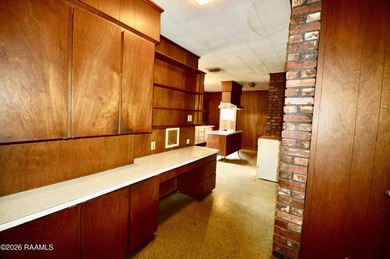 Welcome to a rare bayou-front opportunity offering privacy