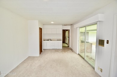 Welcome to a rare bayou-front opportunity offering privacy