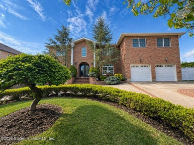 Welcome to 699 Ionia Avenue, a stunning brick-front center hall - photo 1