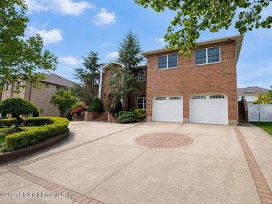 Welcome to 699 Ionia Avenue, a stunning brick-front center hall - photo 2