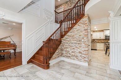 Welcome to 699 Ionia Avenue, a stunning brick-front center hall - photo 4