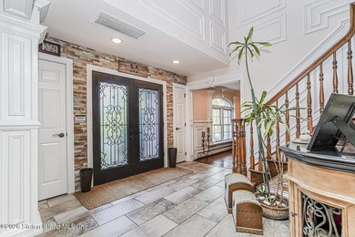 Welcome to 699 Ionia Avenue, a stunning brick-front center hall - photo 6