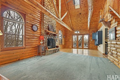 Welcome to this beautiful waterfront log home tucked away on a - photo 2