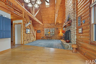Welcome to this beautiful waterfront log home tucked away on a - photo 3