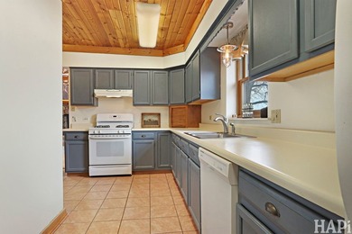 Welcome to this beautiful waterfront log home tucked away on a - photo 6