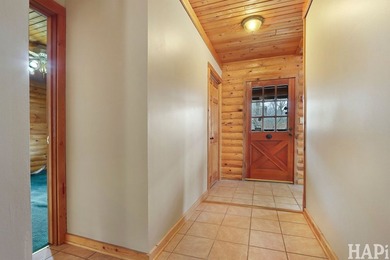 Welcome to this beautiful waterfront log home tucked away on a - photo 8