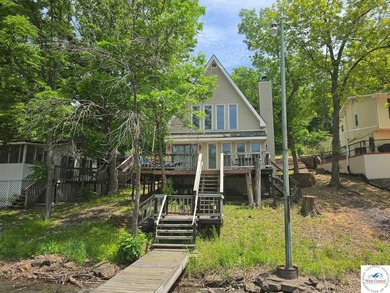 Discover refined lakeside living in this impeccably maintained - photo 2