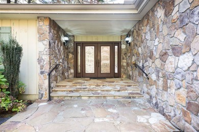 Set along the peaceful shores of Lake Toxaway, this inviting - photo 2