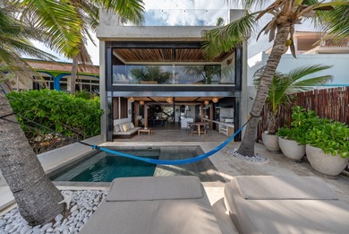 This beach house is absolutely amazing! Located in a beautiful - photo 2