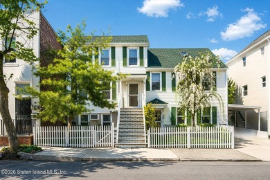 Welcome to this well-maintained three-family home in the highly - photo 1