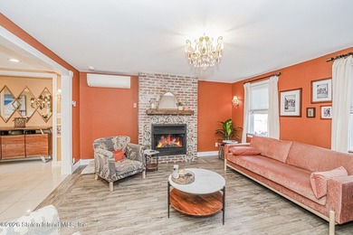 Welcome to this well-maintained three-family home in the highly - photo 2