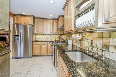 Welcome to this well-maintained three-family home in the highly - photo 5