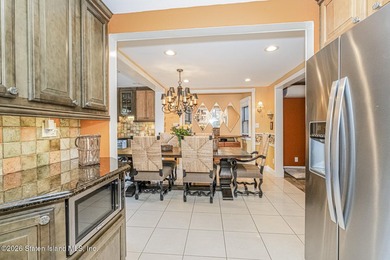 Welcome to this well-maintained three-family home in the highly - photo 6