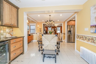 Welcome to this well-maintained three-family home in the highly - photo 7