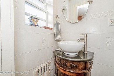 Welcome to this well-maintained three-family home in the highly - photo 9