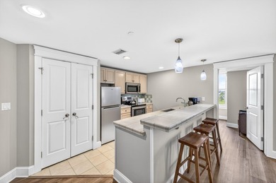 THIS BEAUTIFUL CORNER UNIT HAS BOTH BAY AND RESORT VIEWS! - photo 2