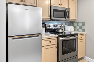 THIS BEAUTIFUL CORNER UNIT HAS BOTH BAY AND RESORT VIEWS! - photo 6