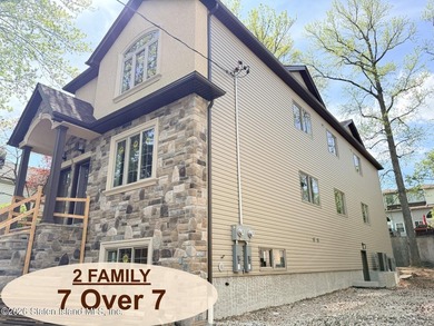 THIS SPACIOUS, DETACHED TWO-FAMILY '7 OVER 7'HOME LOCATED IN THE - photo 1