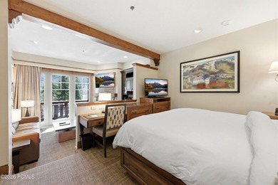 Perched on the top floor, this beautifully updated executive - photo 2