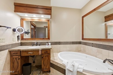 Perched on the top floor, this beautifully updated executive - photo 10