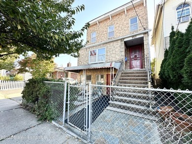Welcome to this charming two-family detached home located in the - photo 2