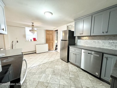 Welcome to this charming two-family detached home located in the - photo 4