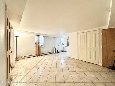 Welcome to this charming two-family detached home located in the - photo 5
