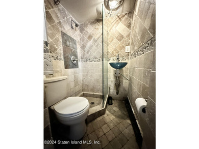 Welcome to this charming two-family detached home located in the - photo 6