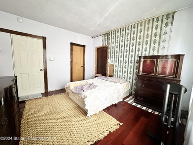 Welcome to this charming two-family detached home located in the - photo 8