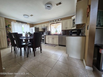 Welcome to this beautiful One Family 4 bedroom, 3 bath Center - photo 9