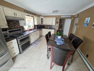 Welcome to this beautiful One Family 4 bedroom, 3 bath Center - photo 10