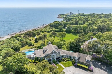 Set on 2.5 acres within the coveted Wings Neck community, this - photo 1