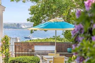 Set on 2.5 acres within the coveted Wings Neck community, this - photo 7