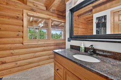 Welcome to this meticulously maintained 2,400 sq. ft. log home - photo 14
