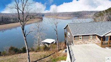 This 3-bedroom, 2.5-bath lakefront home offers over 2,000 square - photo 3